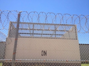 barbed wires over detention center