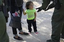 A Latina child being separated from her family.